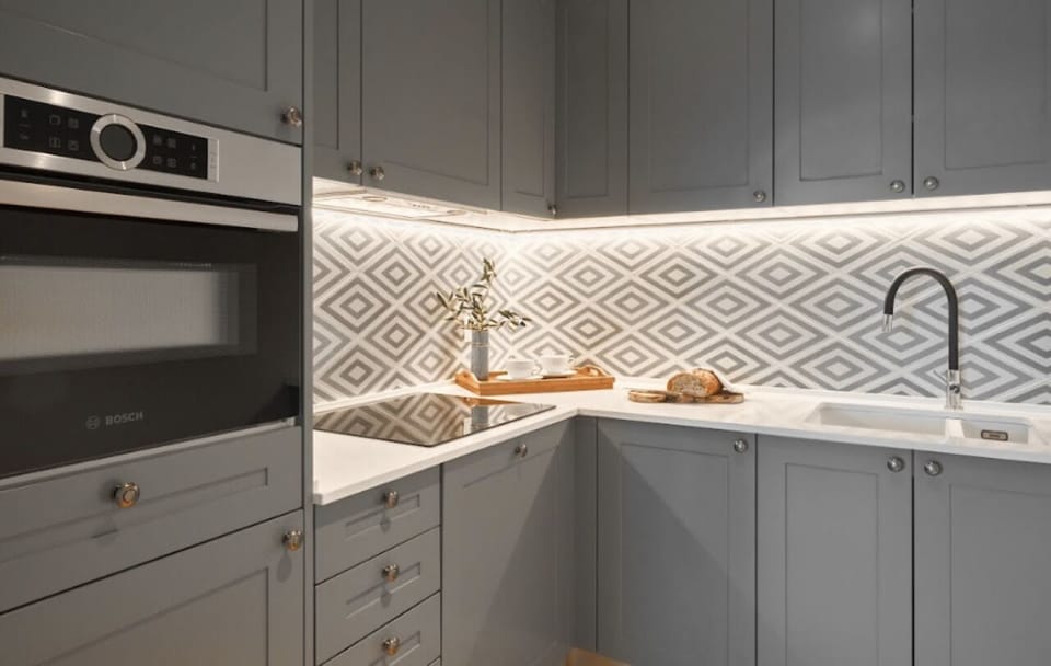 Prep meals on clean counters with modern built-in appliances.