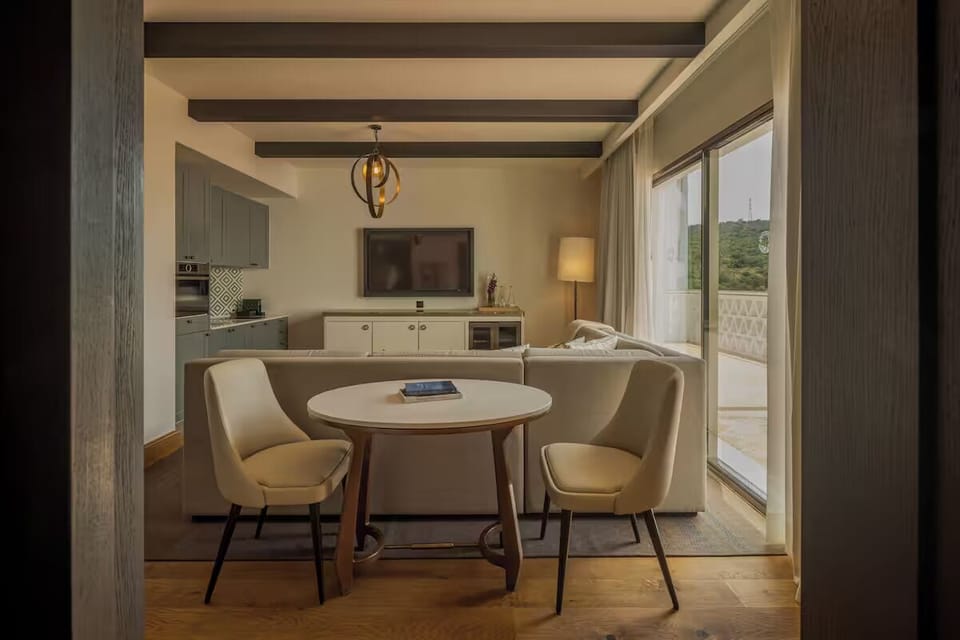 Sip coffee at the table before stepping onto the terrace.