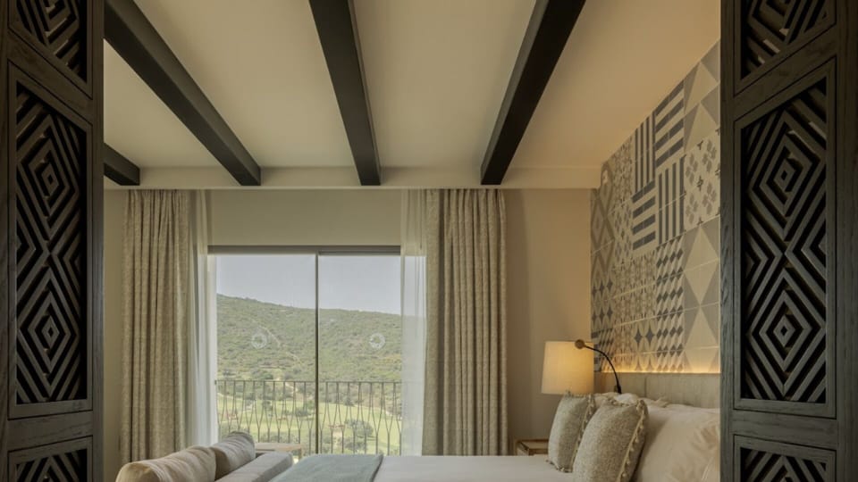 Recharge in a serene retreat framed by elegant wood details.