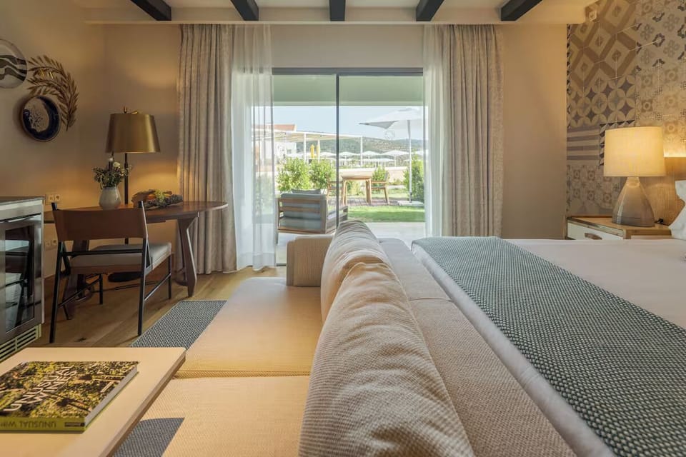 Lounge by the window as sunlight pours into the room.