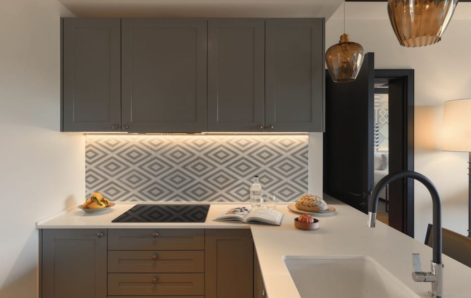 Cook with ease in this sleek, softly lit designer kitchen.