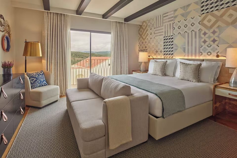 Wake up to mountain views from a luxurious king bed.