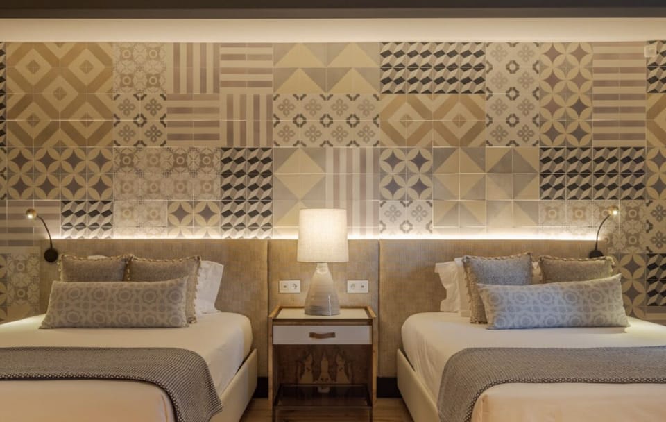 Settle into crisp linens and soft lighting for restful sleep.