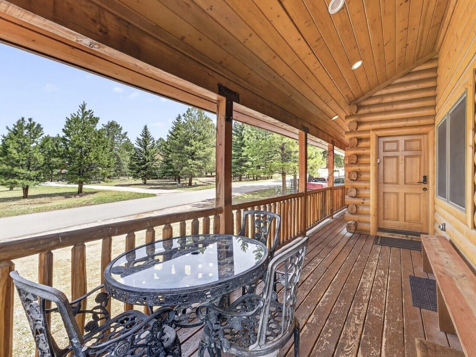 Covered Deck | Outdoor Seating Area & Bench Seating | Forest Views