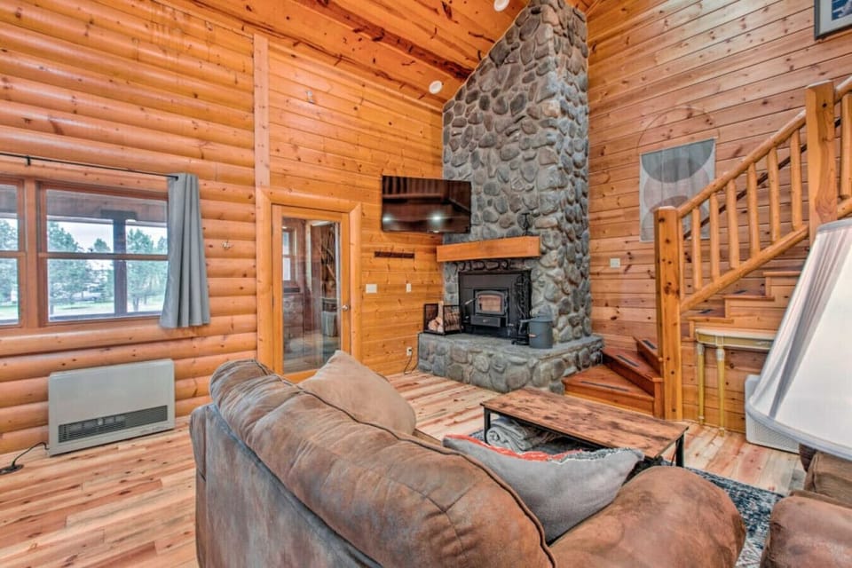 Living Room | Stone Fireplace, Wood Ceilings & Wood Burning Stove