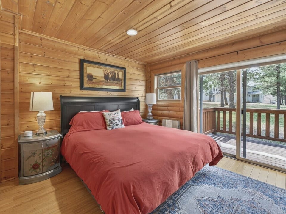 Bedroom 1 | King Bed & Wall Mounted TV | Private Deck Access and En-Suite Bathroom