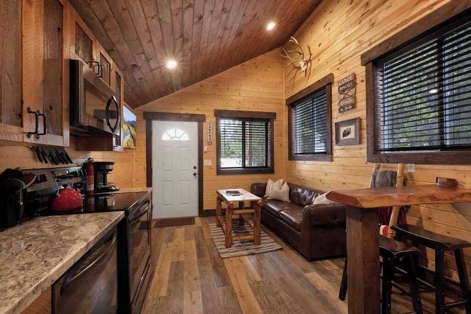 The living room with seating and tv for entertainment.