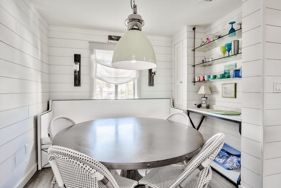Dining - This cozy nook features a custom-designed banquette and four bistro chairs so that you can seat everyone around this table for a meal or board games.