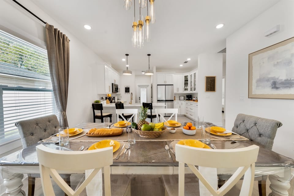 Gather around this elegant dining table set for a memorable meal. Seating for the whole group with stylish place settings - perfect for family dinners or a celebratory brunch.