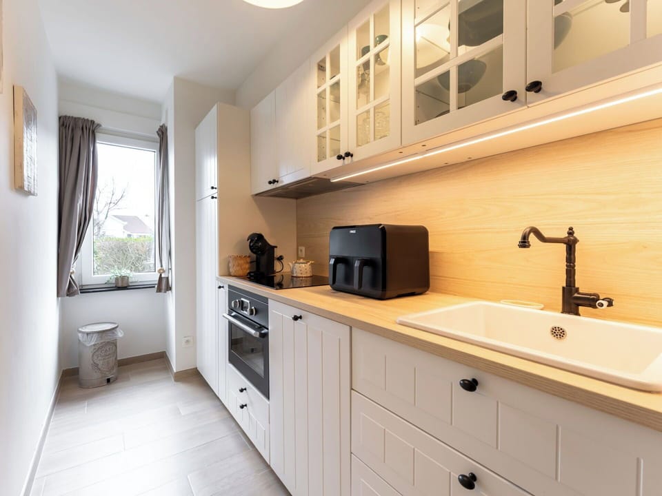 Countertop, Kitchen, Cabinetry, Kitchen Appliance, Furniture, Interior Design, Flooring, Wood, Major Appliance, Drawer