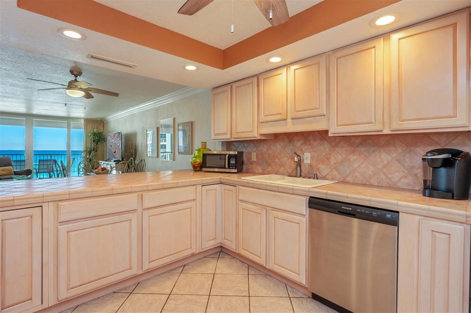 Your fully equipped kitchen awaits with stunning ocean views while you cook and unwind in this coastal paradise.