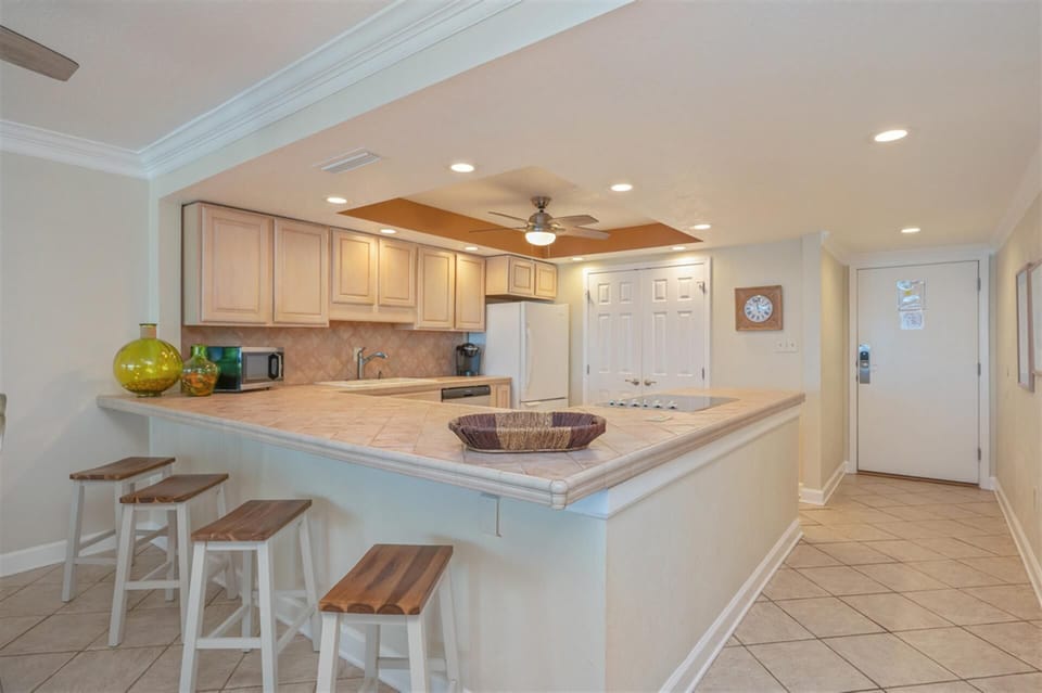 Your spacious kitchen features a breakfast bar perfect for morning coffee and casual meals together.