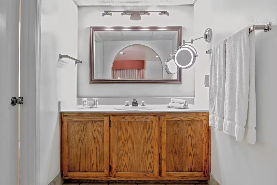 Refresh at the bright vanity with fluffy towels ready