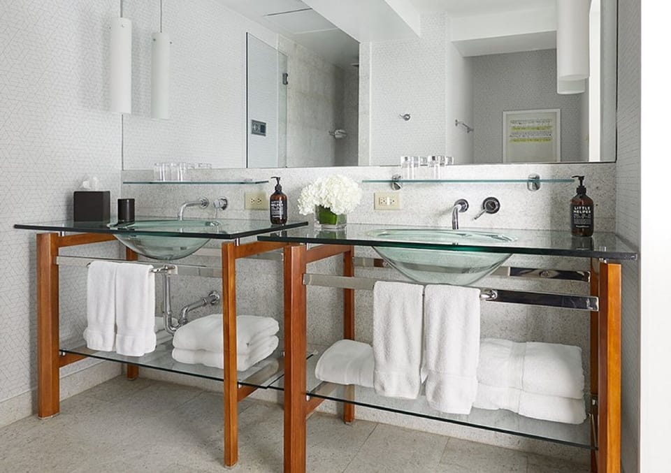 Refresh with dual sinks, bright mirrors, and spa-clean towels.