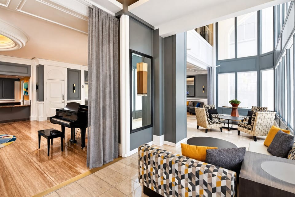Sip coffee by tall windows while the city hums outside.