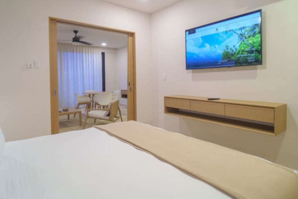 Relax in bed with streaming-ready TV and quiet, modern finishes.
