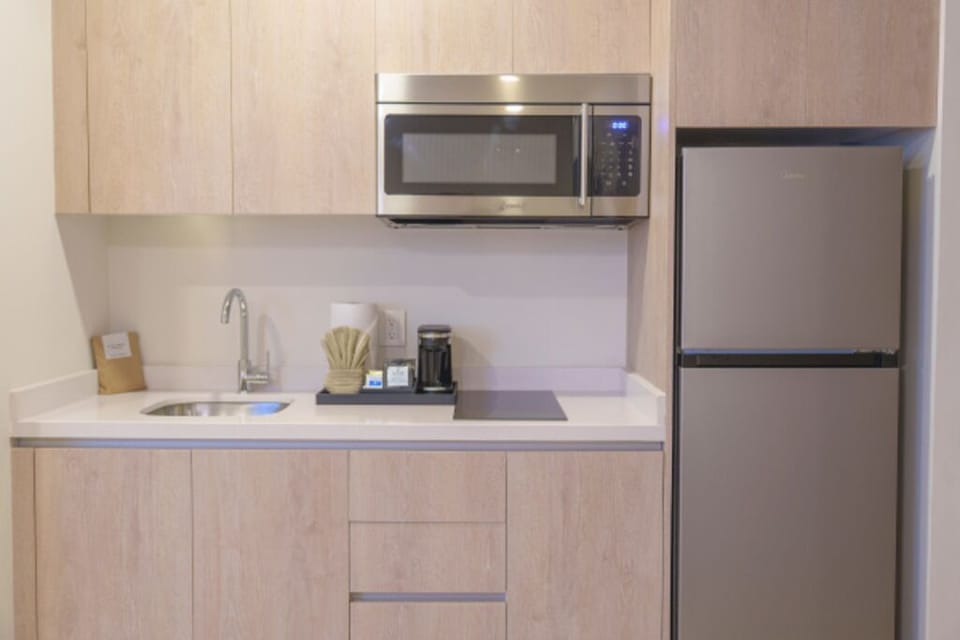 Brew coffee and prep snacks with convenient in-room kitchenette.