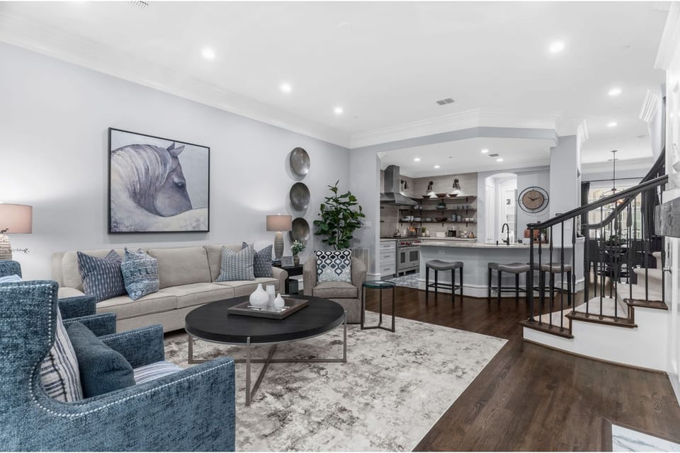 Elegant 2nd-floor living space featuring a cozy fireplace and seamless flow.
