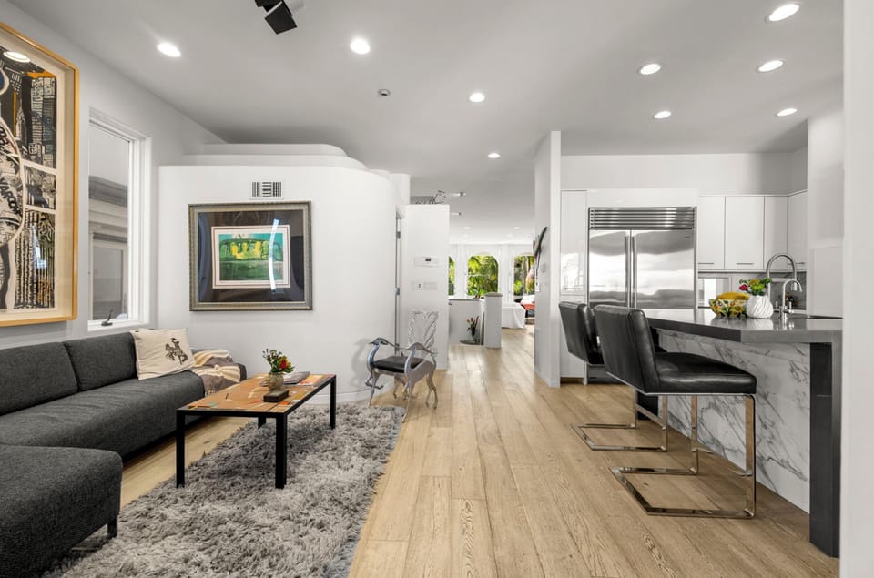 Cozy lounge area off the kitchen for socializing during meal preparation.
