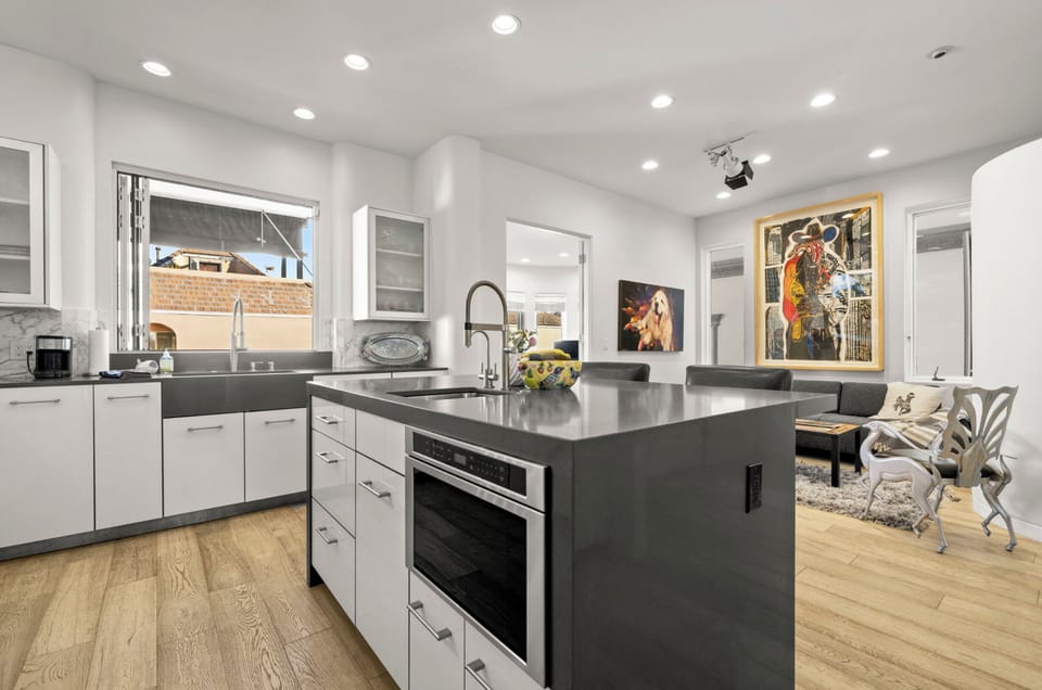 Chef's kitchen island and space for lounging during meal preparation. 
