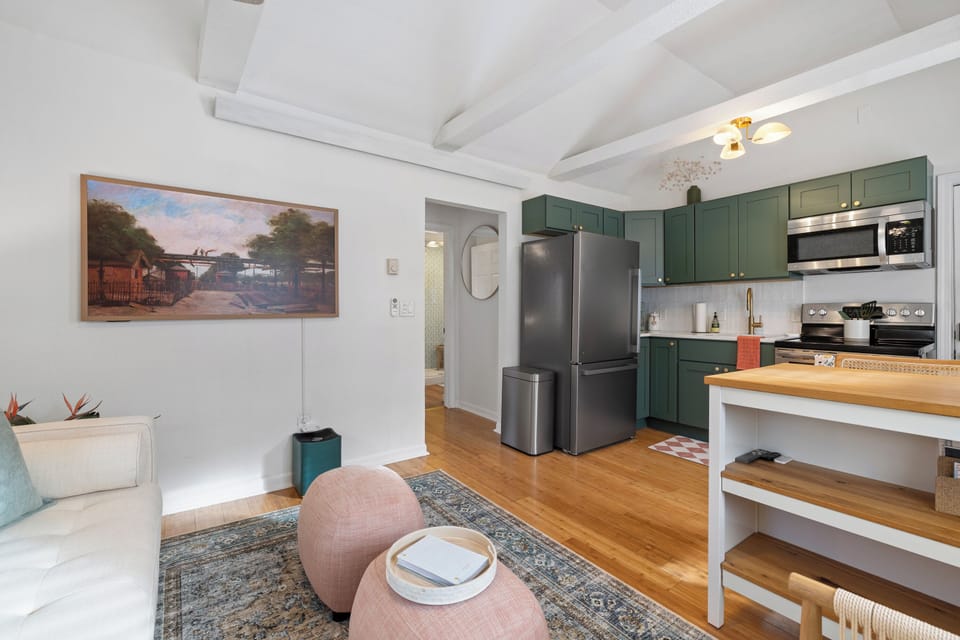 Open concept living room and kitchen with island seating.