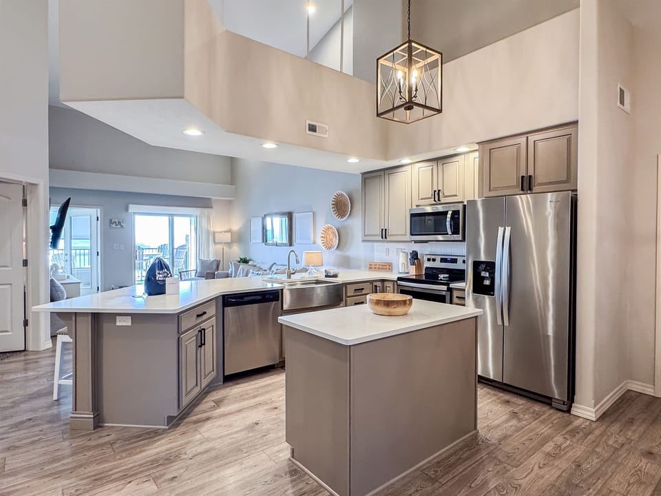 Kitchen overview with island and welcome bag for guests to enjoy