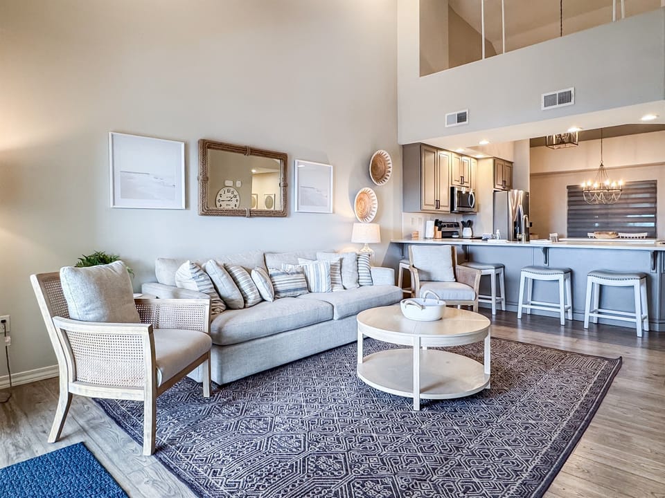 Living room seating and bar seating for more options for dining 