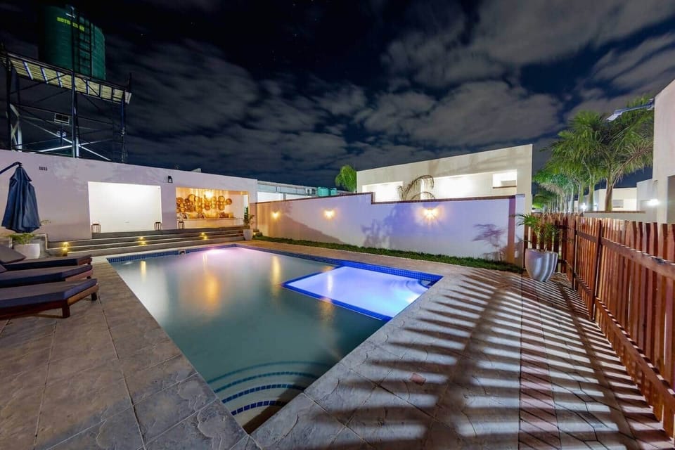 Shared swimming pool with evening lighting
