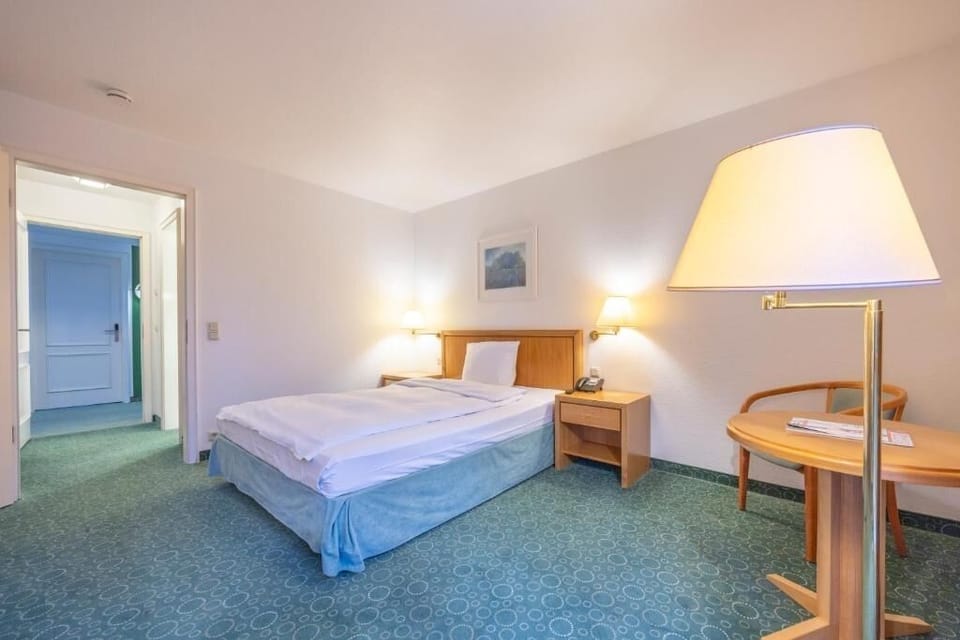 Relax together in a simple, airy room with soft lighting.