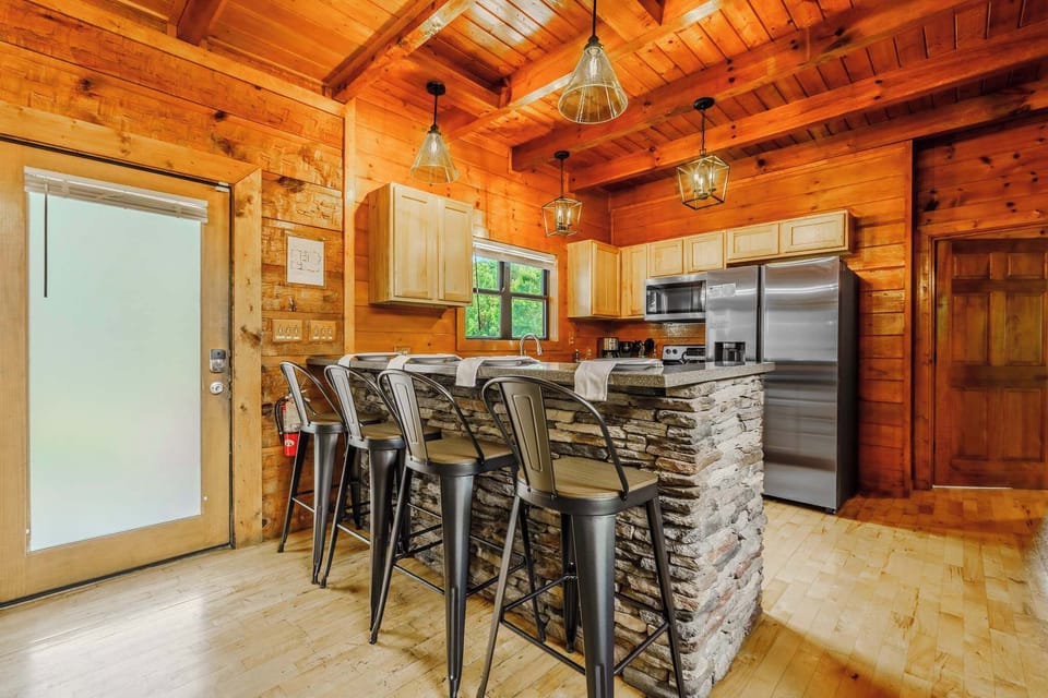 Whip up culinary delights at the stylish bar with rustic charm and modern appliances!