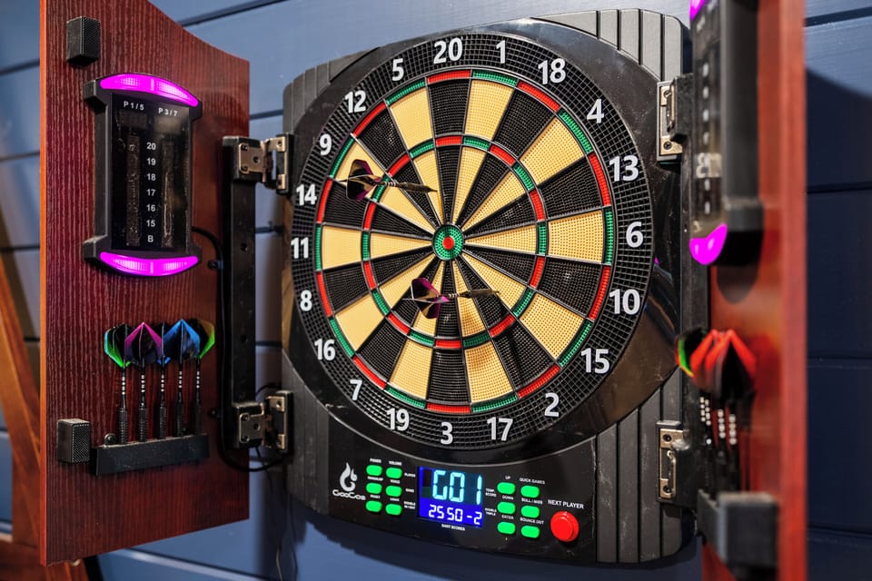 LED-lit electronic dartboard with digital scoring. 