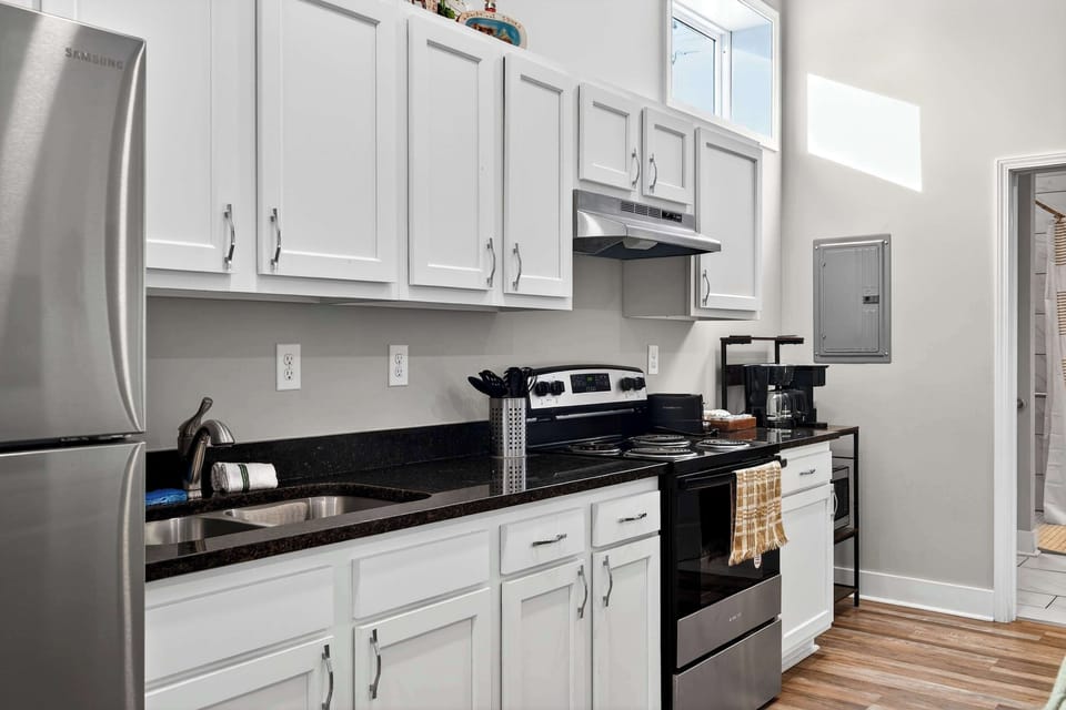 Kitchen: Compact kitchen with smart design and all essentials for easy, convenient cooking.