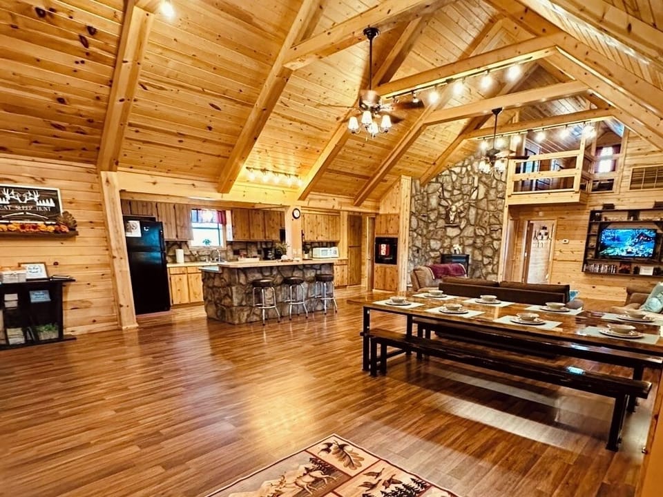 Classic cabin vibes and open concept living/dining/kitchen make this the perfect retreat for friends and families. 