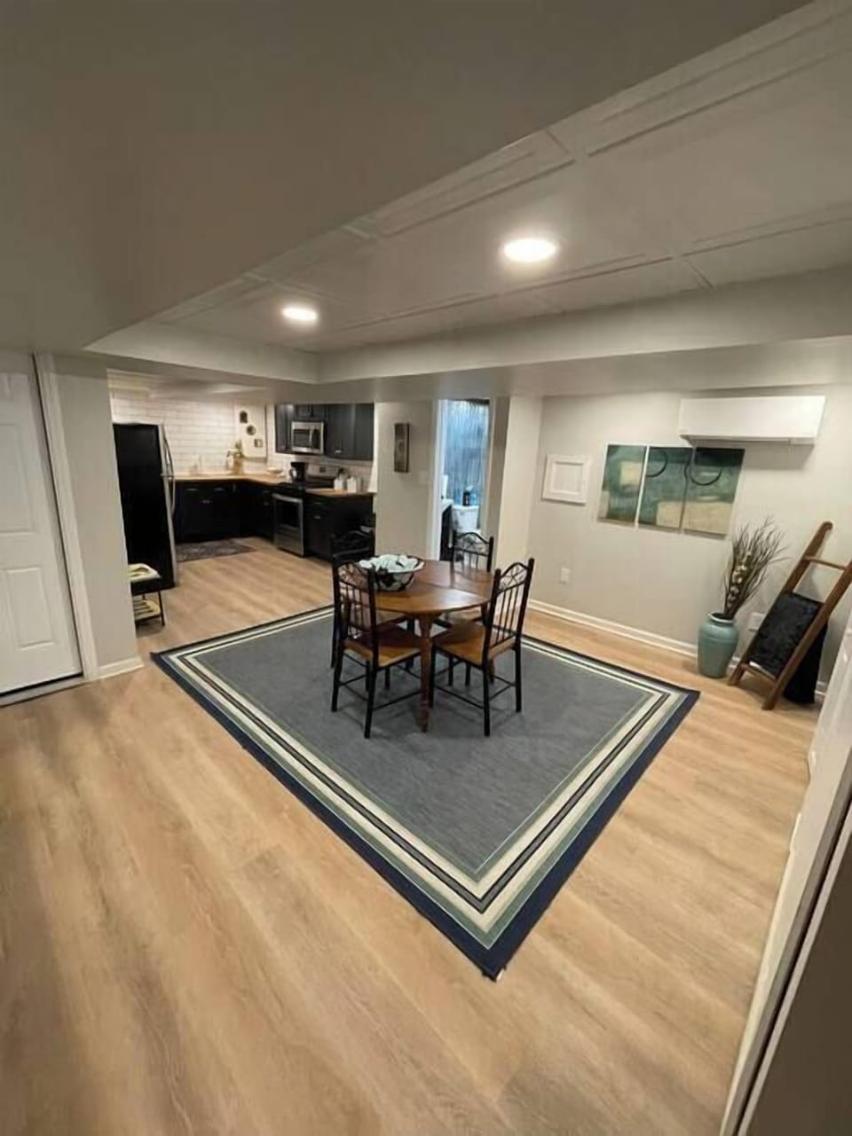 Expanded view looking towards the dining, kitchen and bathroom spaces. 