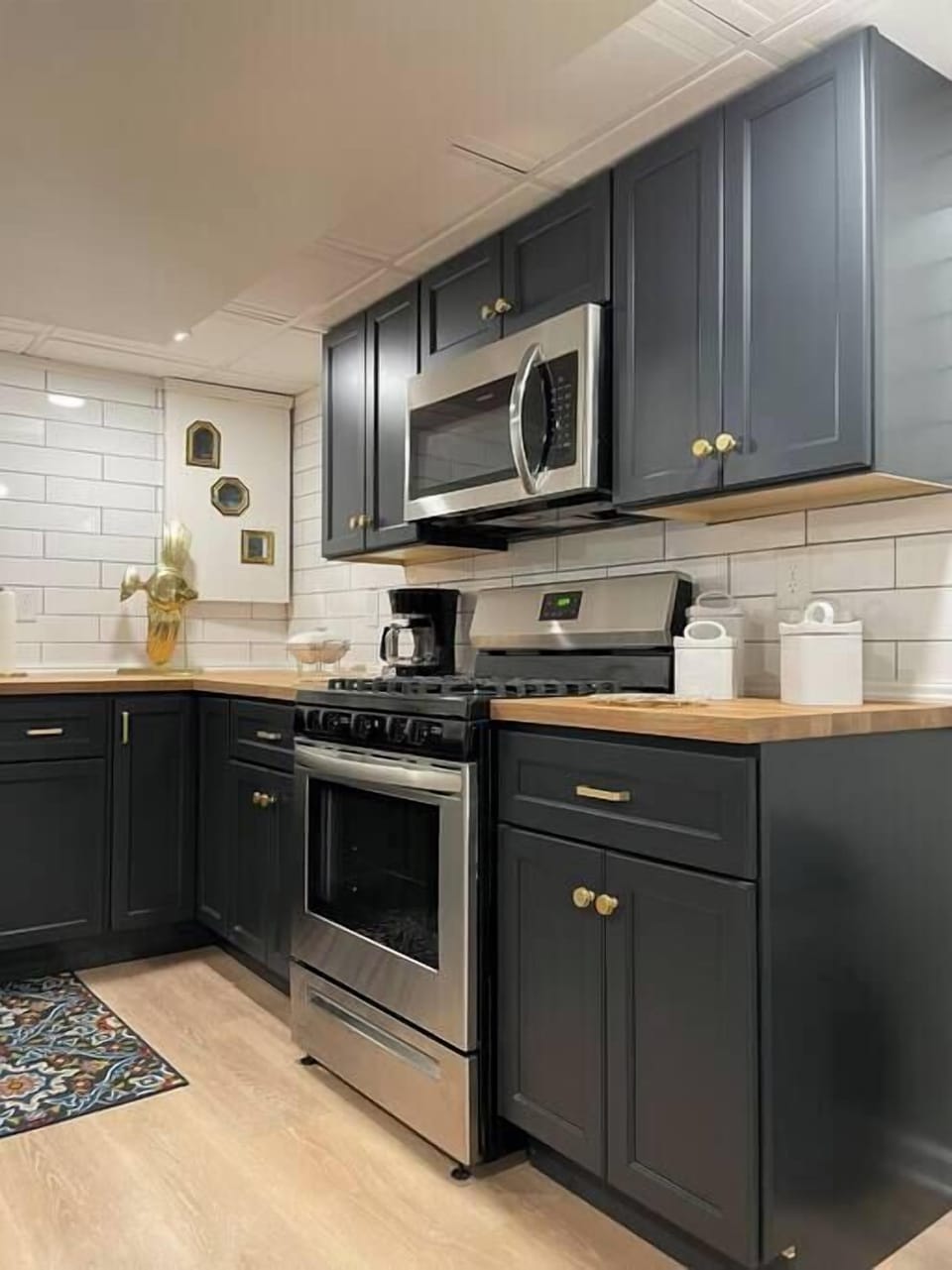 Completely remodeled - full kitchen, with coffee maker, dishwasher, range, microwave and fridge.  We also provide all of the basic cooking utensils. 