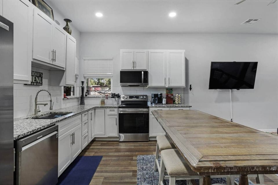 Main kitchen with large island table seating seating  