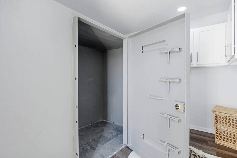 Interior storm shelter located within the main living structure