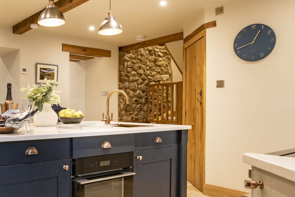 Ground floor: Stairs from the kitchen lead to the first floor