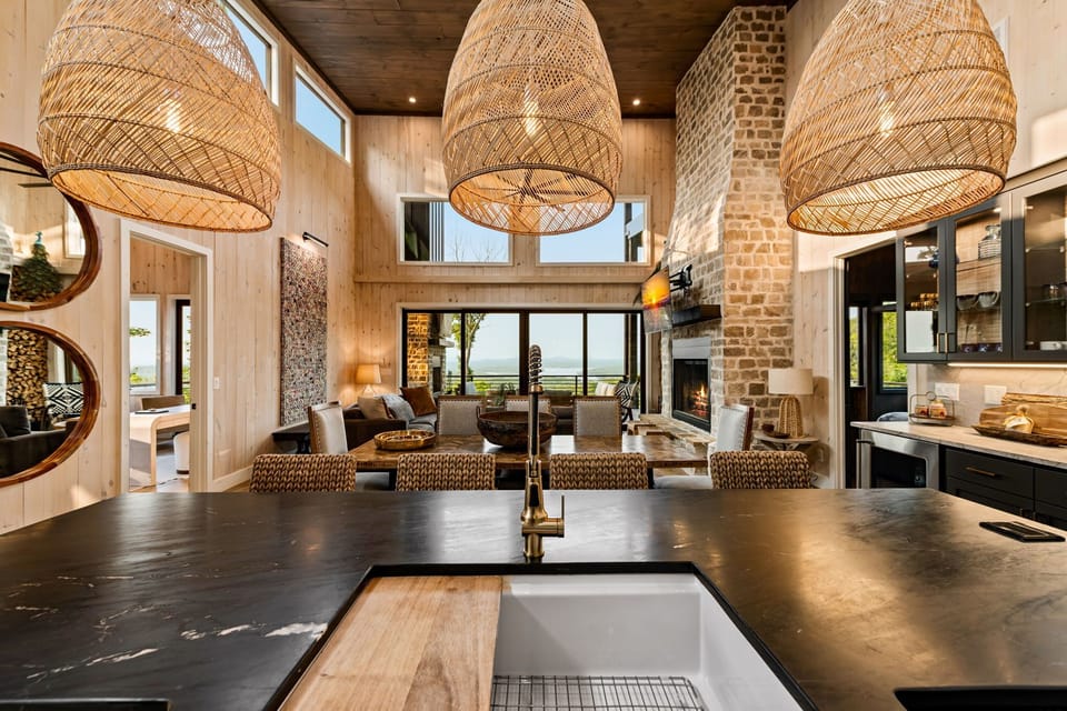 Entertain in the chef’s kitchen w/  large island, prep sink, and mountain views.