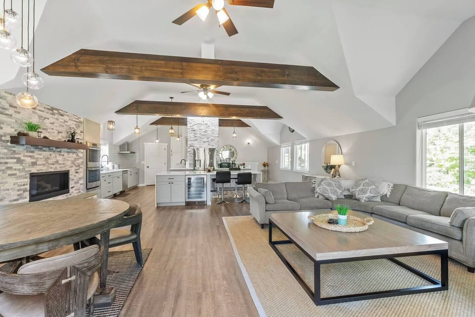 The space flows seamlessly into the kitchen, making sure the whole group feels connected whether lounging in the seating area or prepping a delicious meal