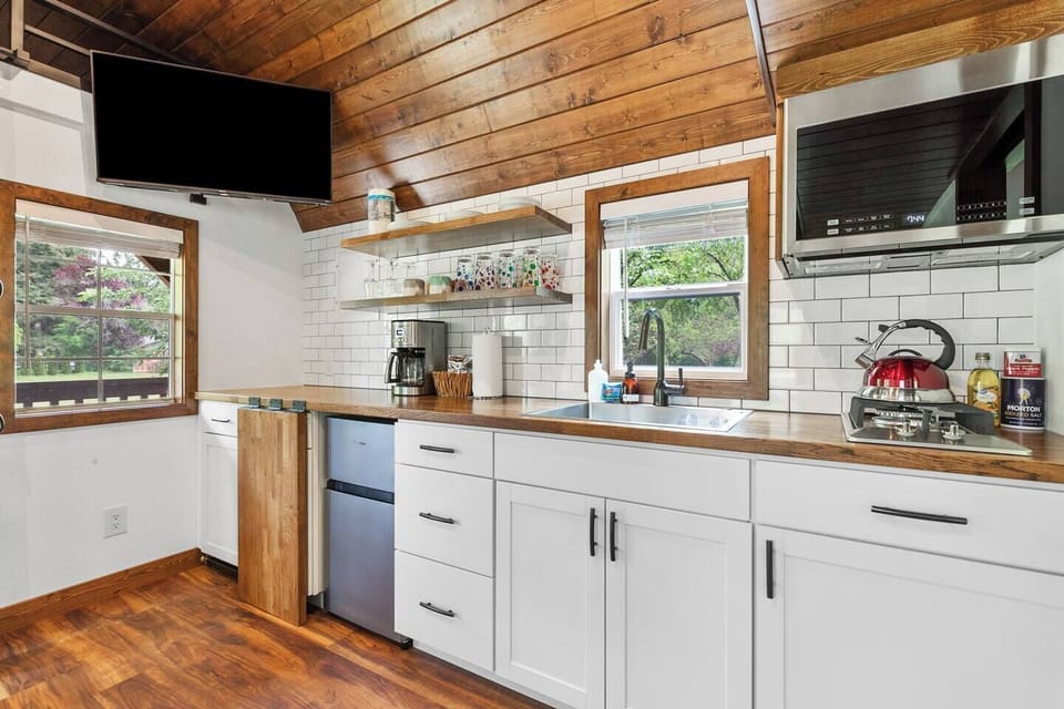 Well-appointed kitchen with microwave, drip coffee, mini fridge, and many other essentials