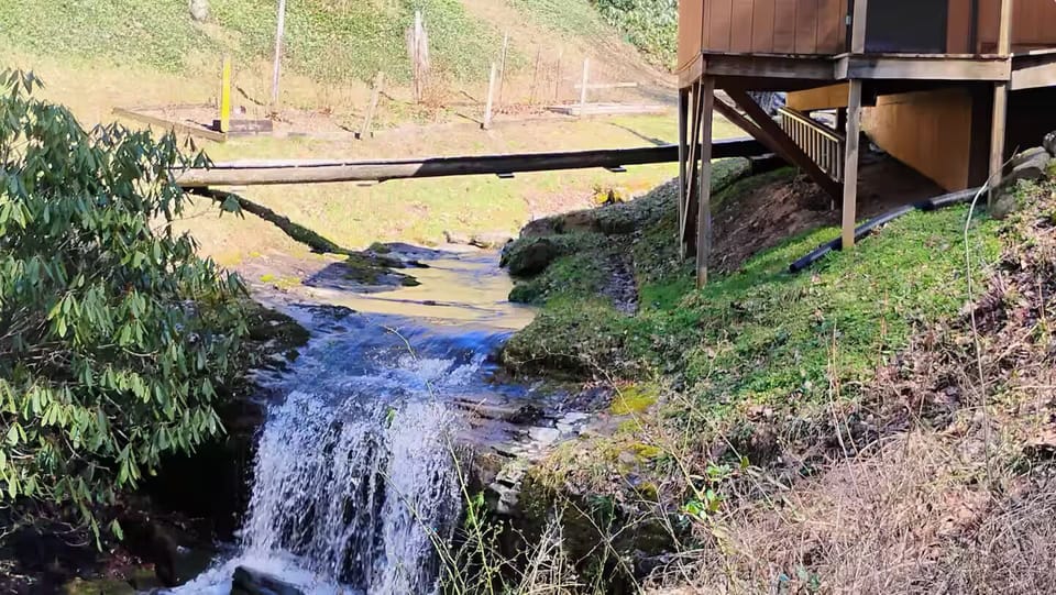 Screened-in porch overlooking waterfall