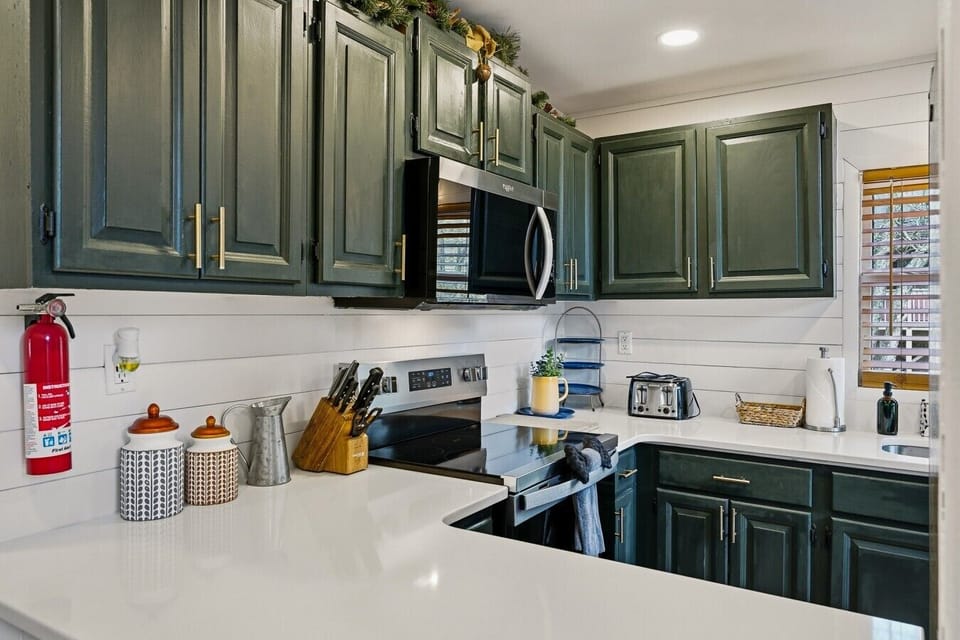 Kitchen | Microwave | Green Cabinets & White Countertops
