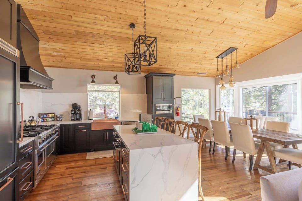 Chef's kitchen with nice open floor plan and stone island.
