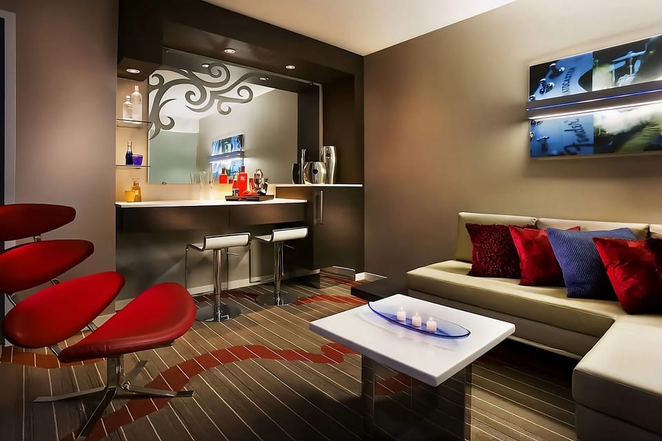 Gather for cocktails at your chic in-suite bar nook.