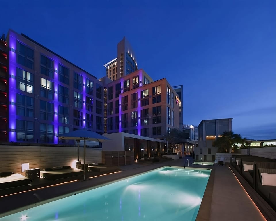 Dive into a glowing night swim with city vibes.