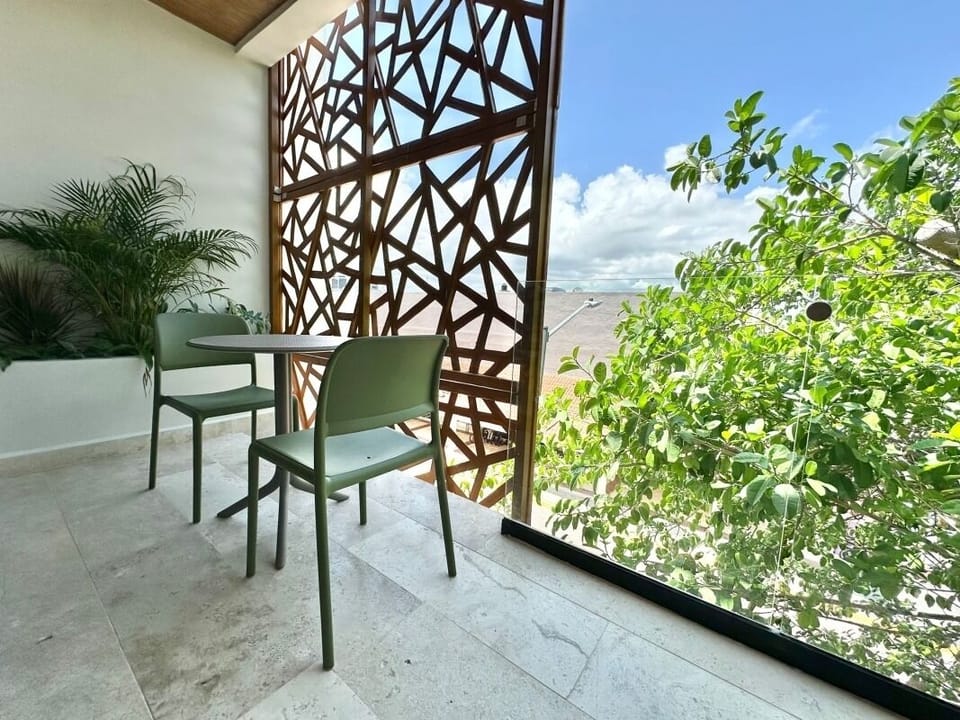 Start mornings with fresh air at the intimate bistro set.