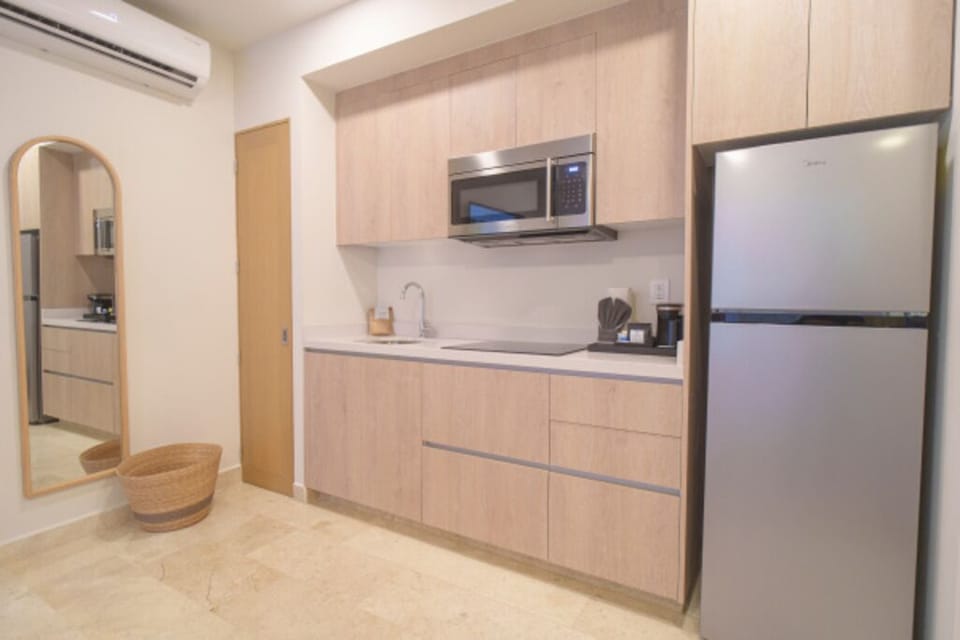 Cook light meals easily with sleek appliances and plenty of storage.