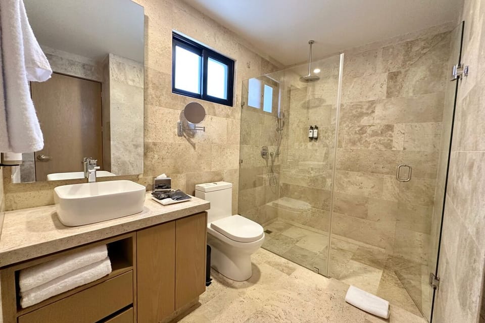 Refresh in a spa-like rain shower with luxe stone finishes.