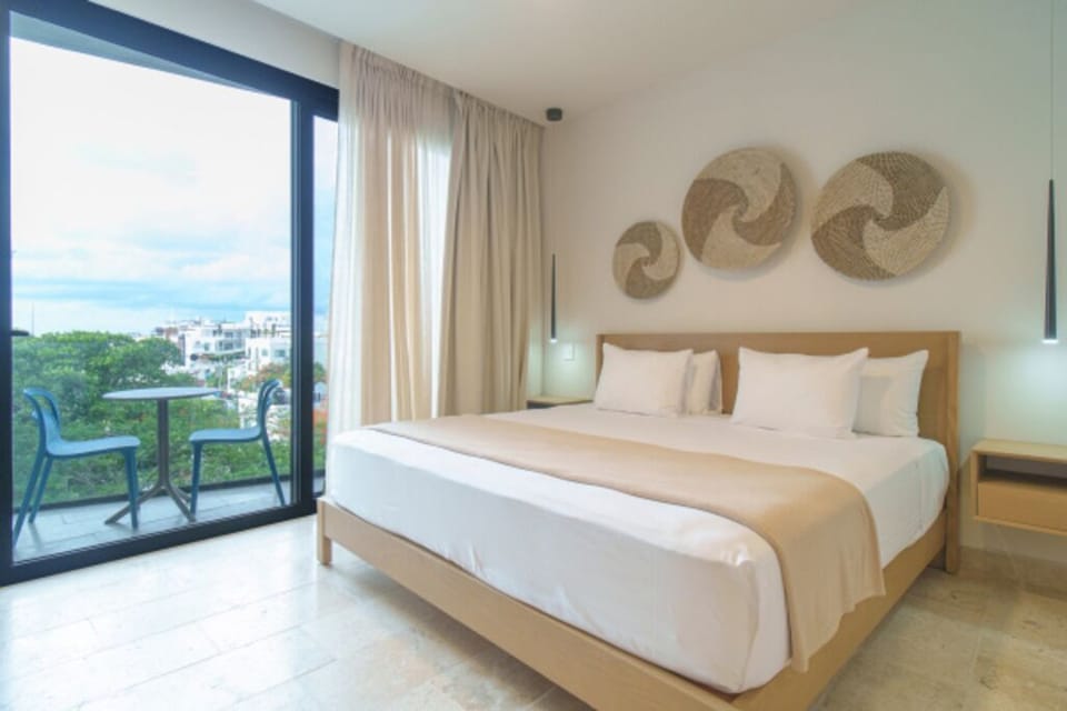 Wake up to sunlit comfort and breezy balcony views.